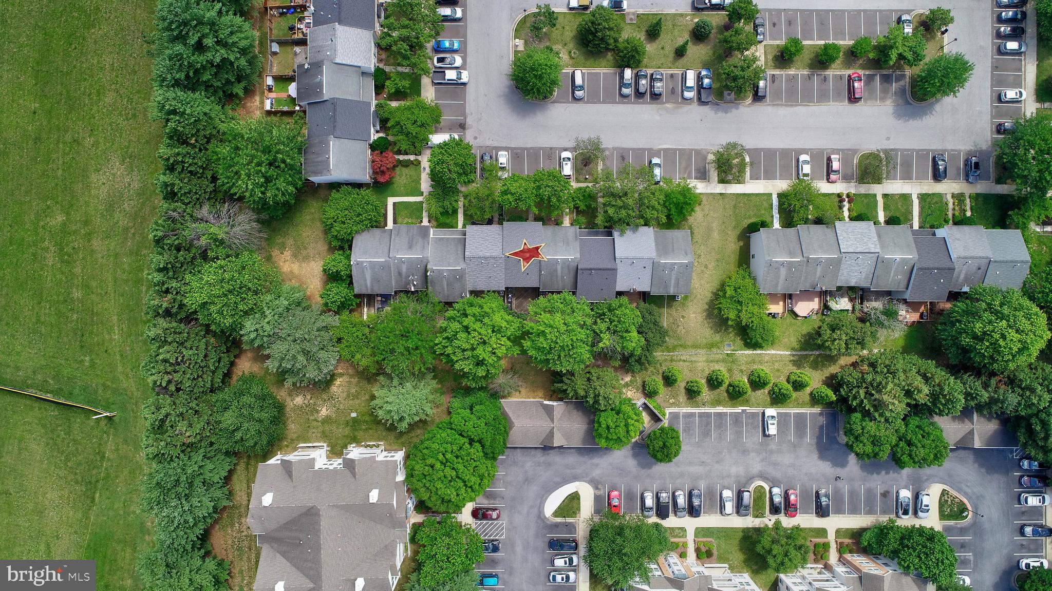6136 Starburn Path Columbia, MD 21045 - Photo 30 of 35 an aerial view of a house with plants and large trees