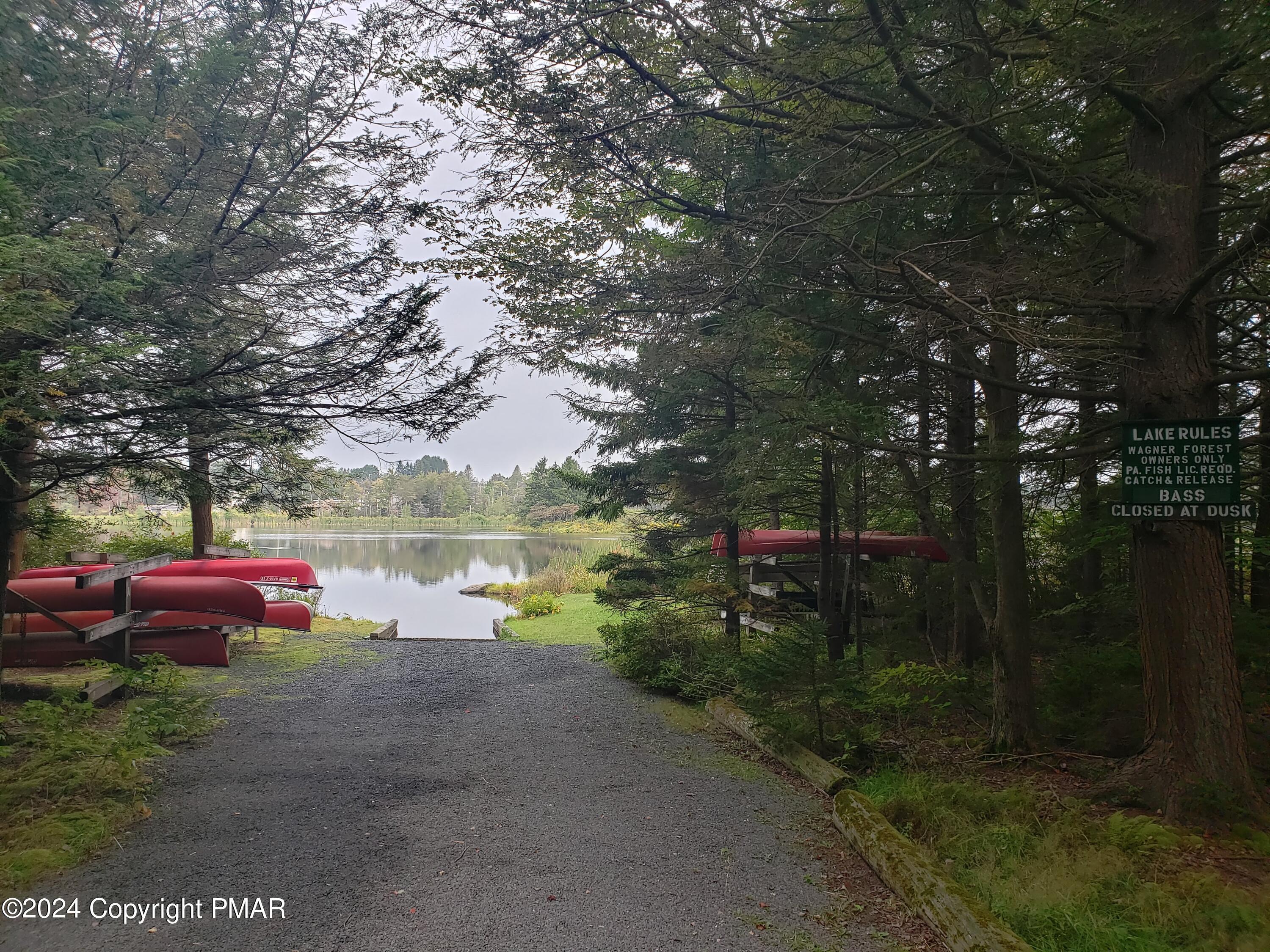 1127 Sawmill Road Pocono Lake, PA 18347 - Photo 5 of 8 a view of street with sitting area