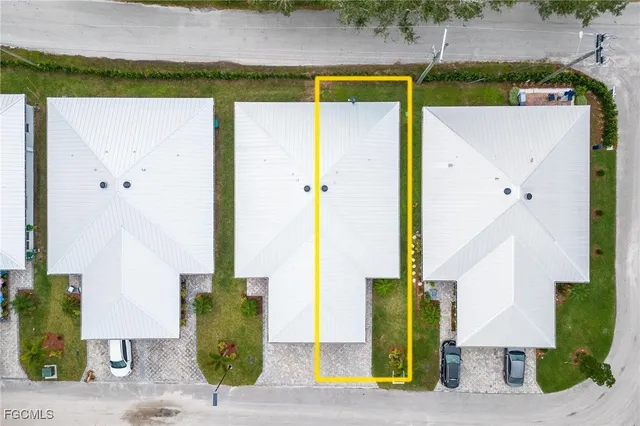an aerial view of a house with a swimming pool