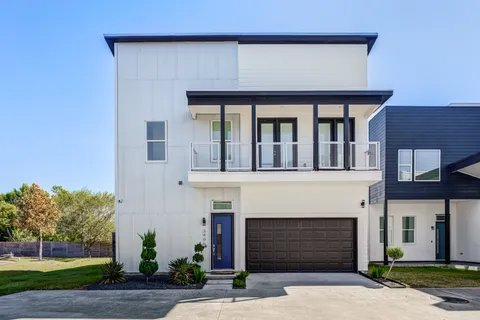 a front view of a house with yard