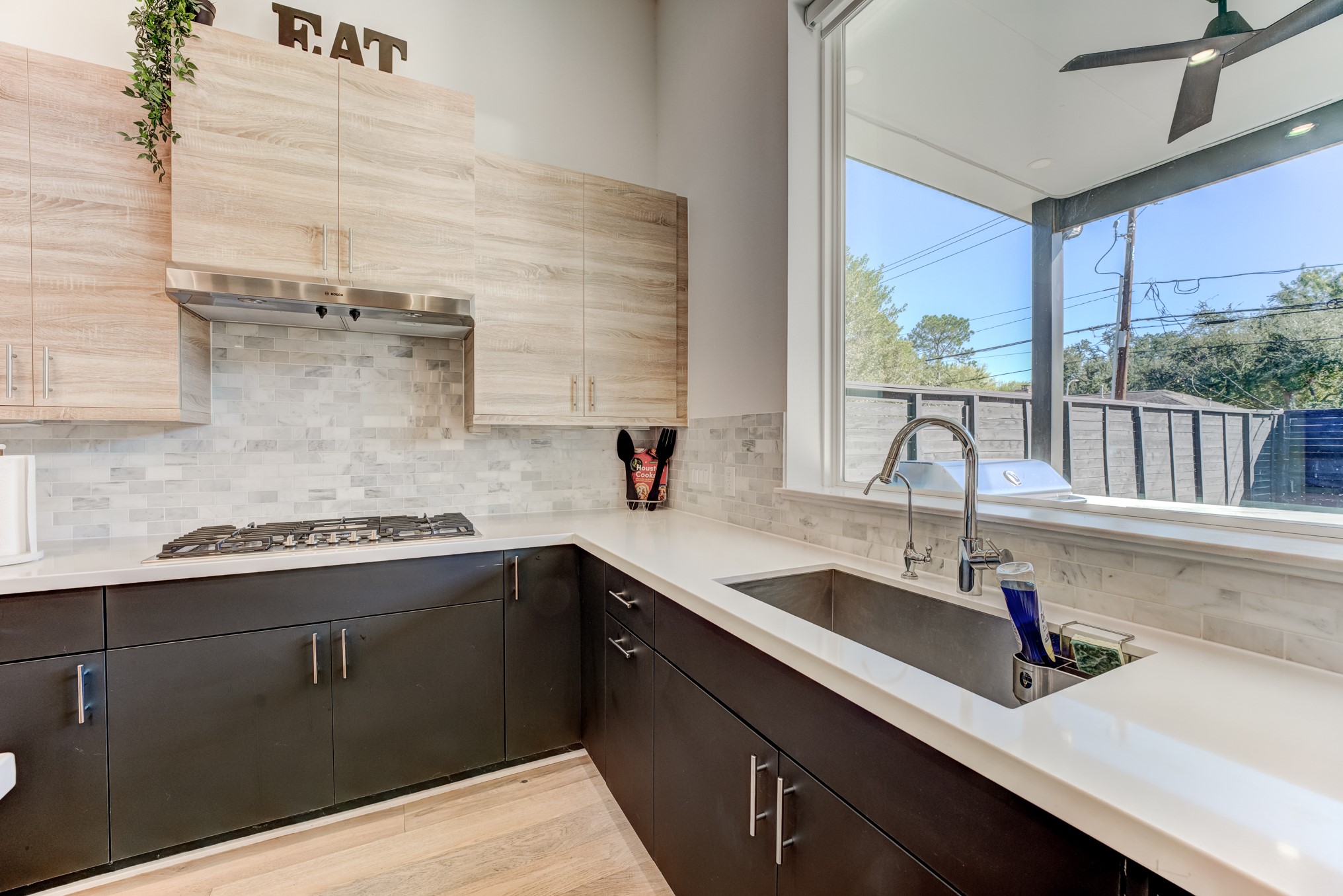 3406 Asher Landing Lane Houston, TX 77080 - Photo 11 of 45 a kitchen with a sink and a window