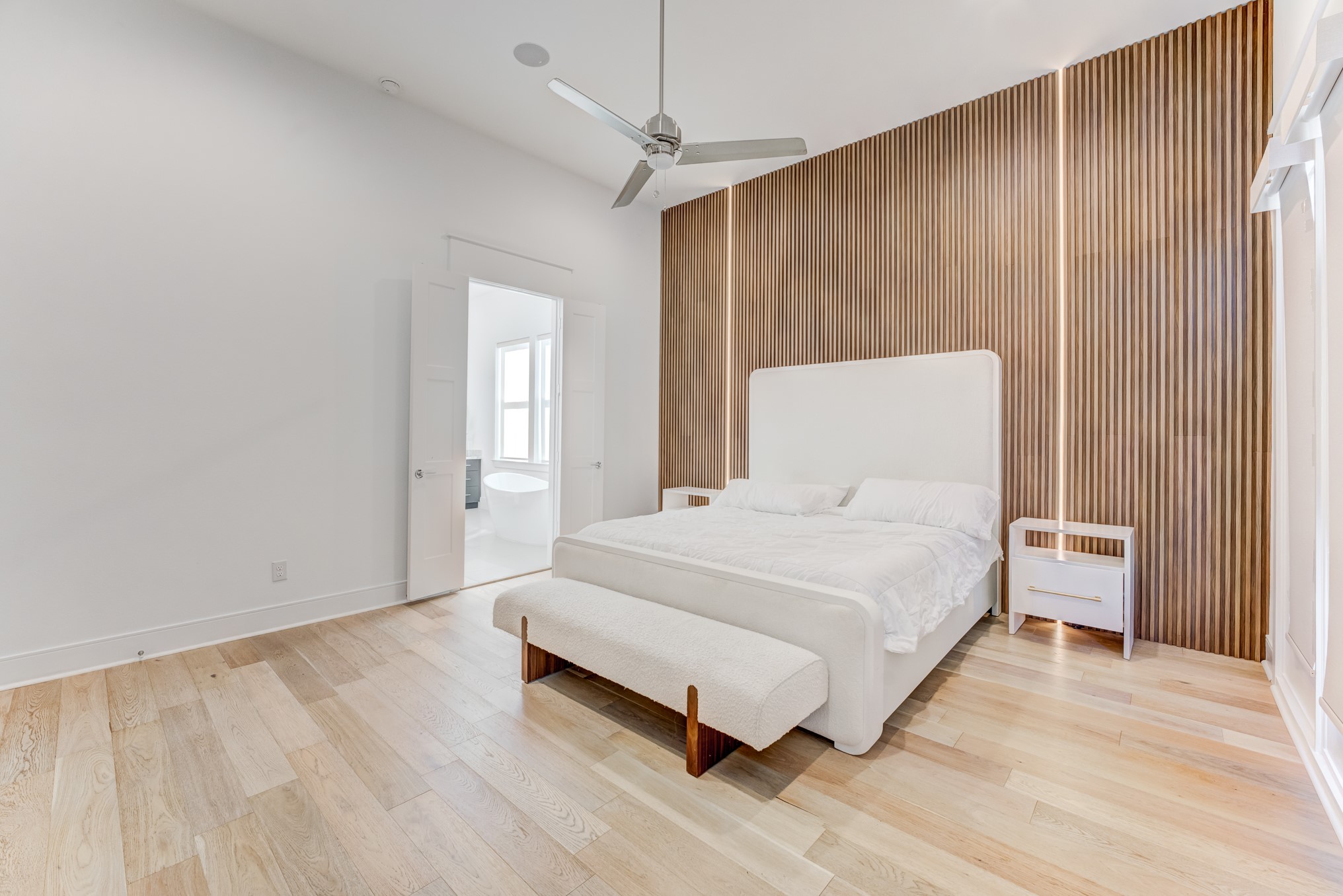 3406 Asher Landing Lane Houston, TX 77080 - Photo 16 of 45 a large bed sitting in a spacious bedroom next to a window