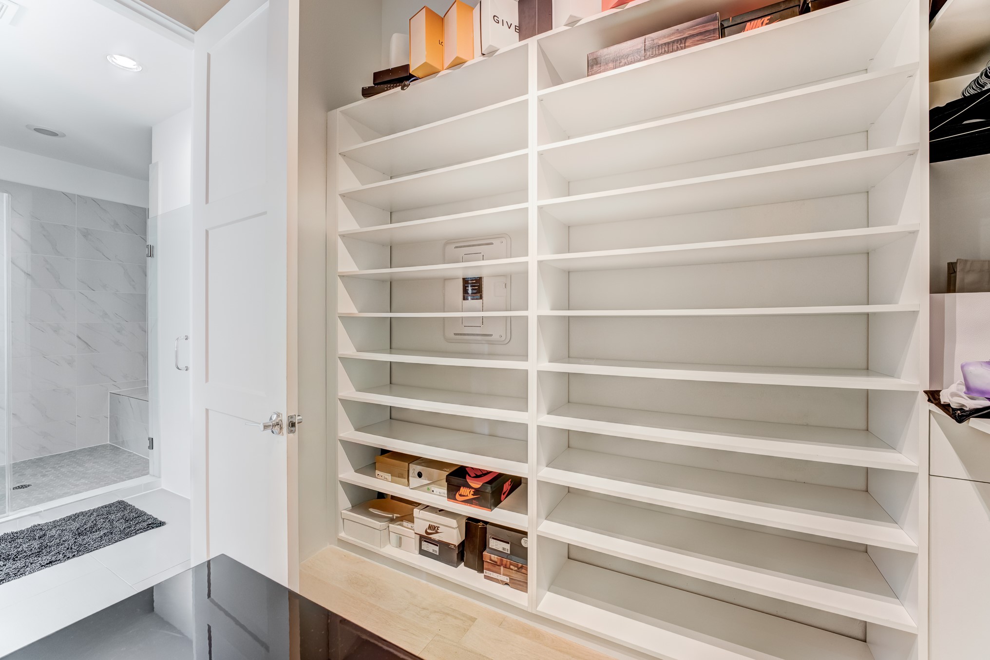 3406 Asher Landing Lane Houston, TX 77080 - Photo 23 of 45 a view of walk in closet with empty racks