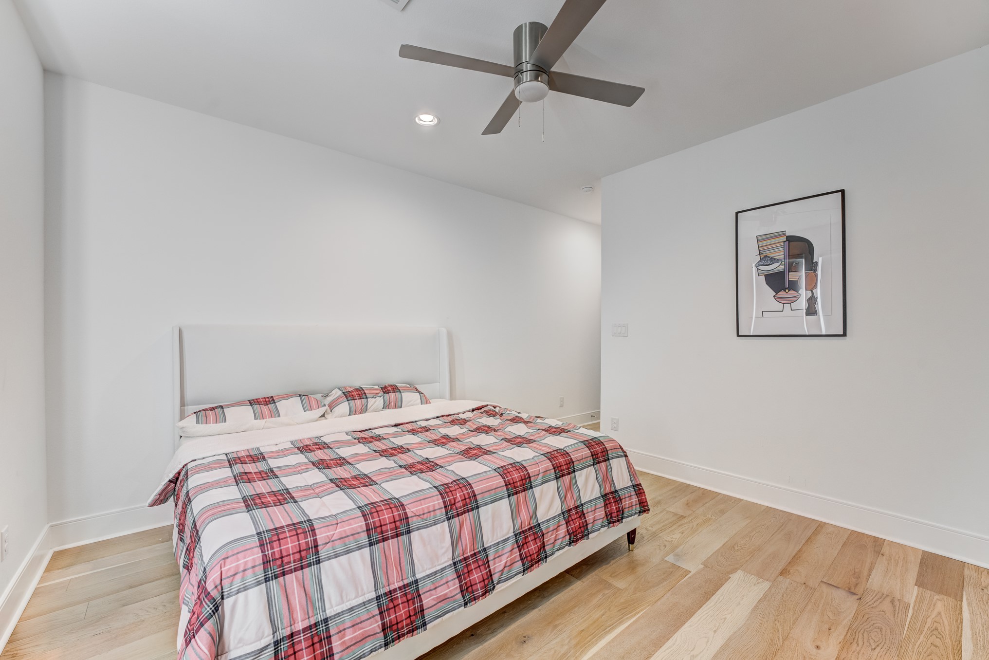 3406 Asher Landing Lane Houston, TX 77080 - Photo 25 of 45 a bedroom with a bed and painting on the wall