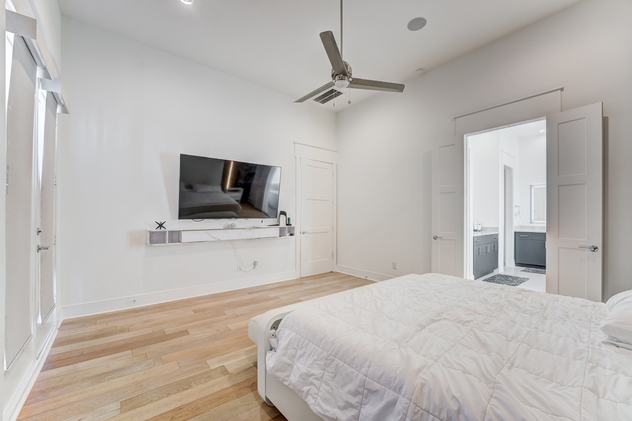 3406 Asher Landing Lane Houston, TX 77080 - Photo 28 of 45 a bedroom with a bed and a flat screen tv