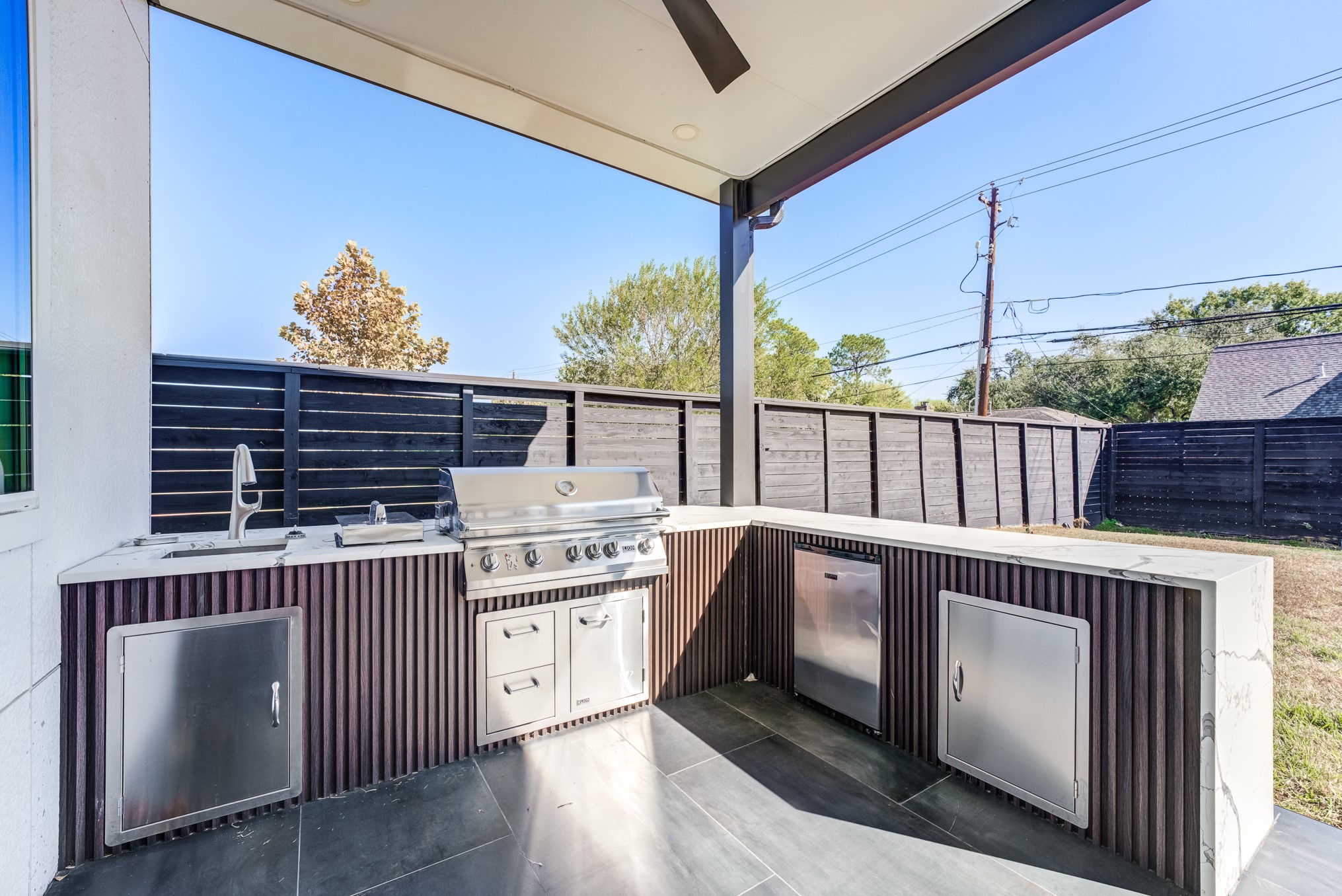 3406 Asher Landing Lane Houston, TX 77080 - Photo 37 of 45 a open kitchen with a sink and wooden cabinets