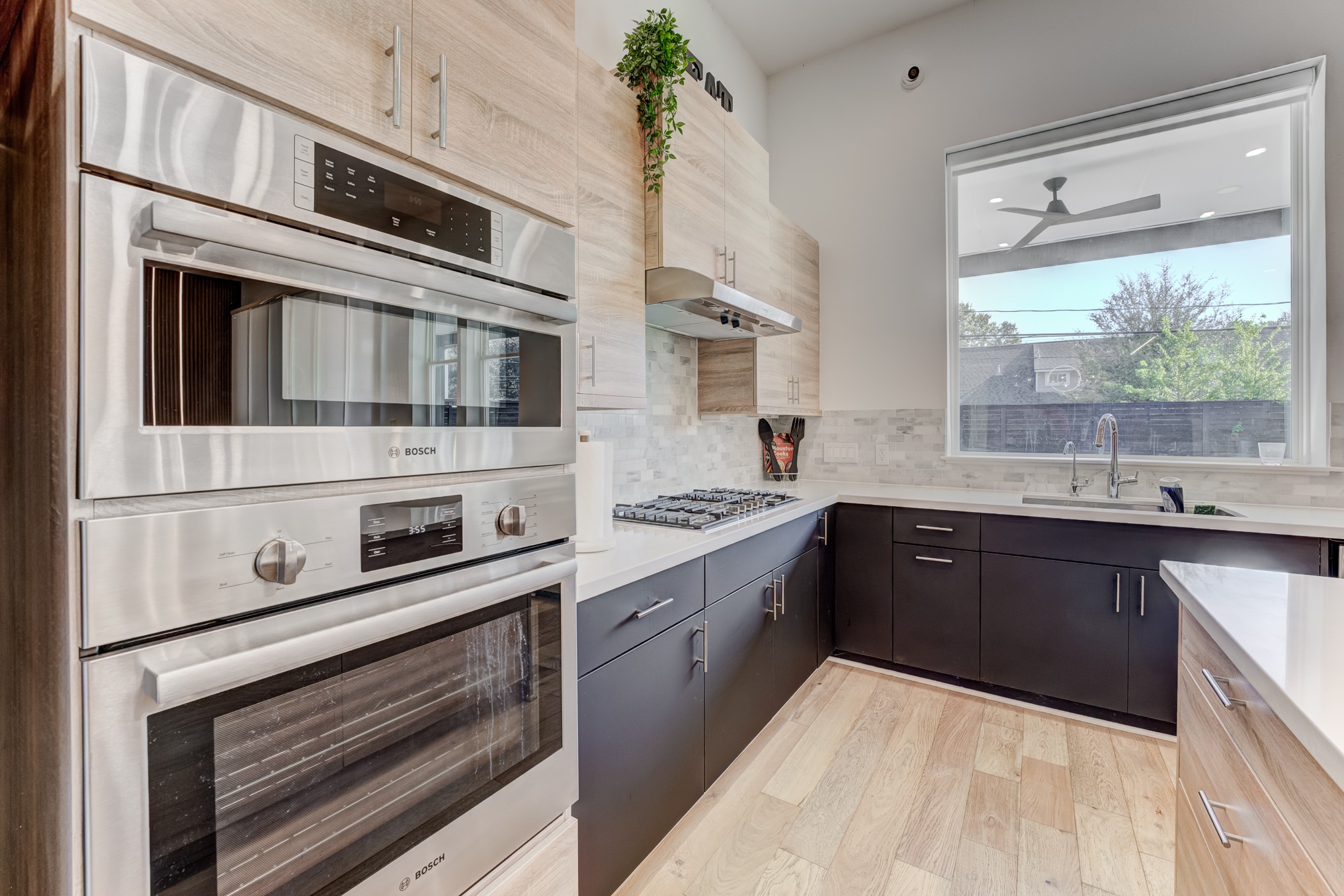 3406 Asher Landing Lane Houston, TX 77080 - Photo 10 of 45 a kitchen with stainless steel appliances granite countertop a stove and a sink