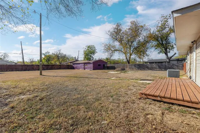 a view of outdoor space with deck and tree