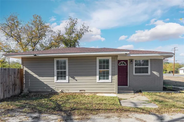front view of a house with a chair