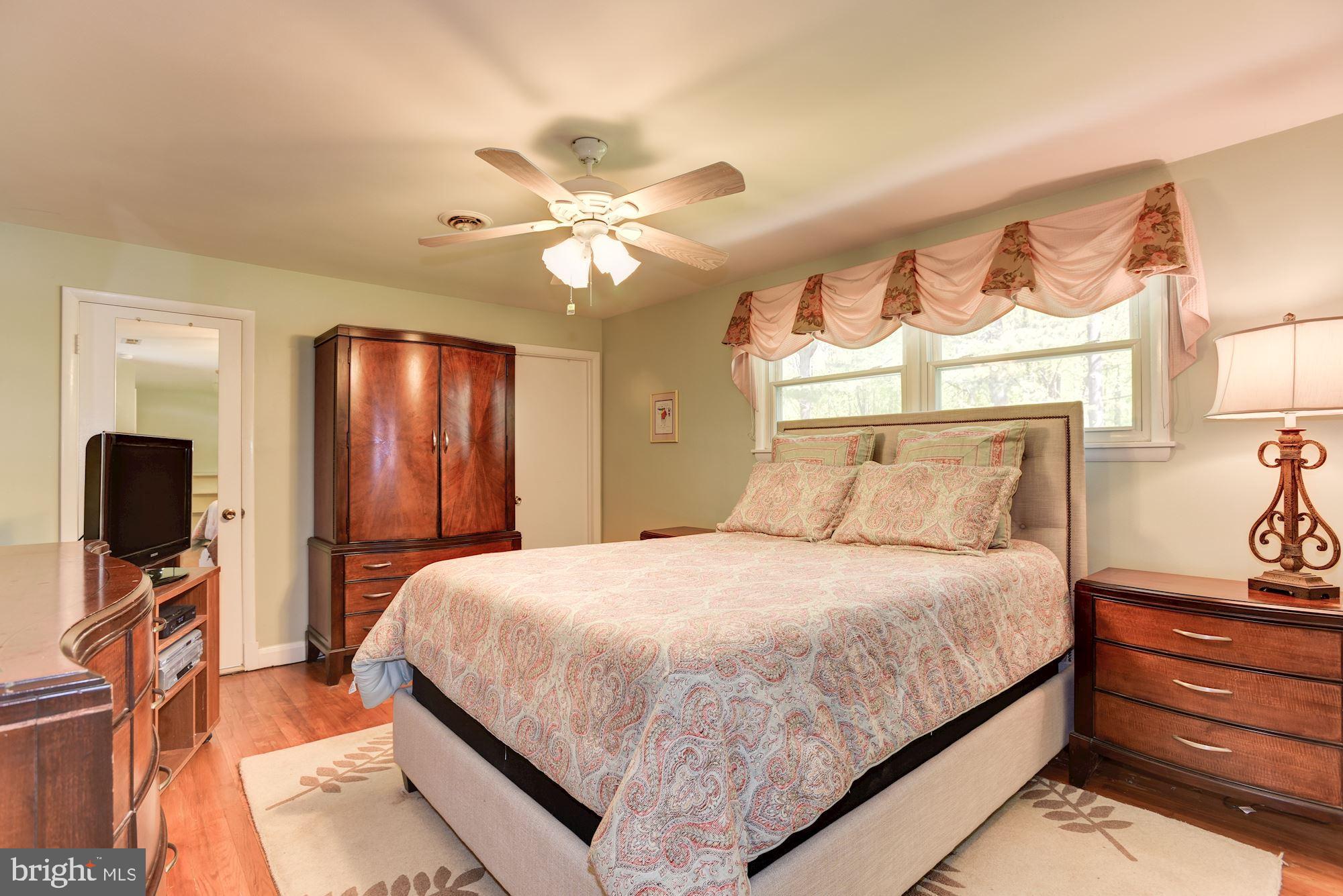 28 Millstone Road Randallstown, MD 21133 - Photo 21 of 45 Primary Bedroom | Hardwood Floors | Walk-In Closet
