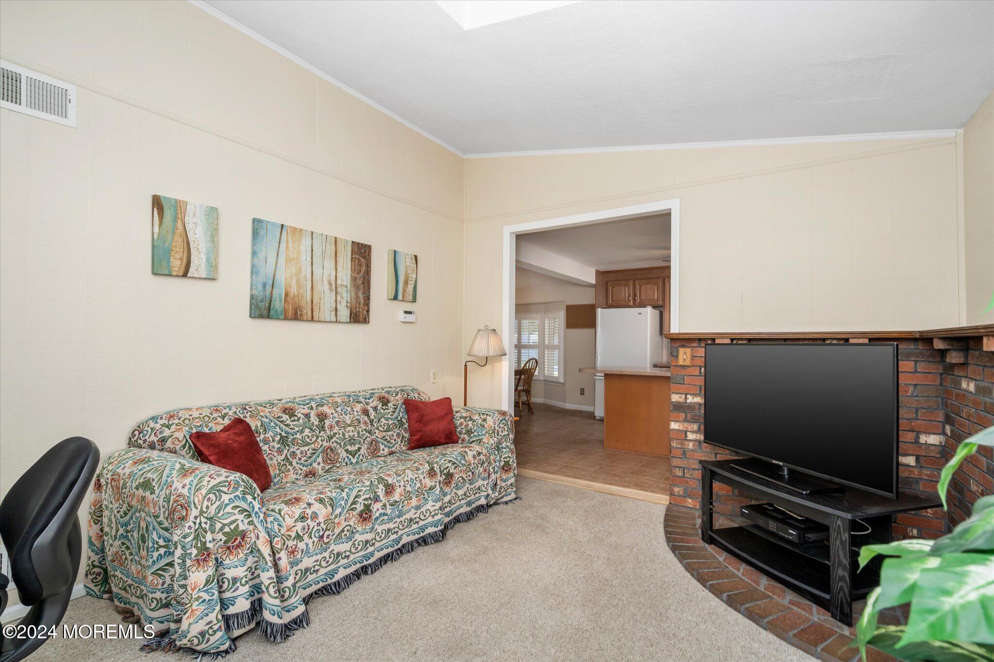 38 Waldron Road Allentown, NJ 08501 - Photo 18 of 43 a living room with furniture and a flat screen tv