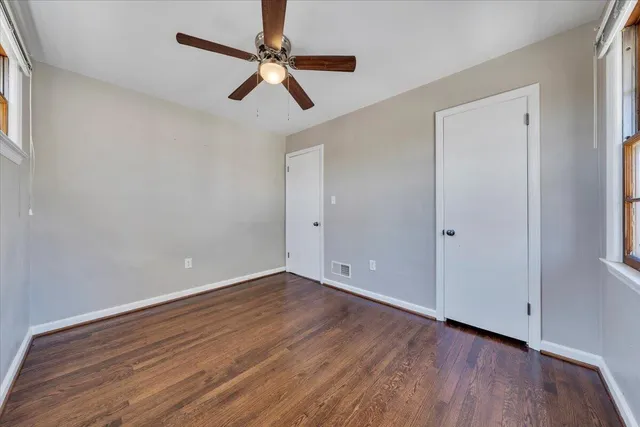 a view of room with hardwood floor and window