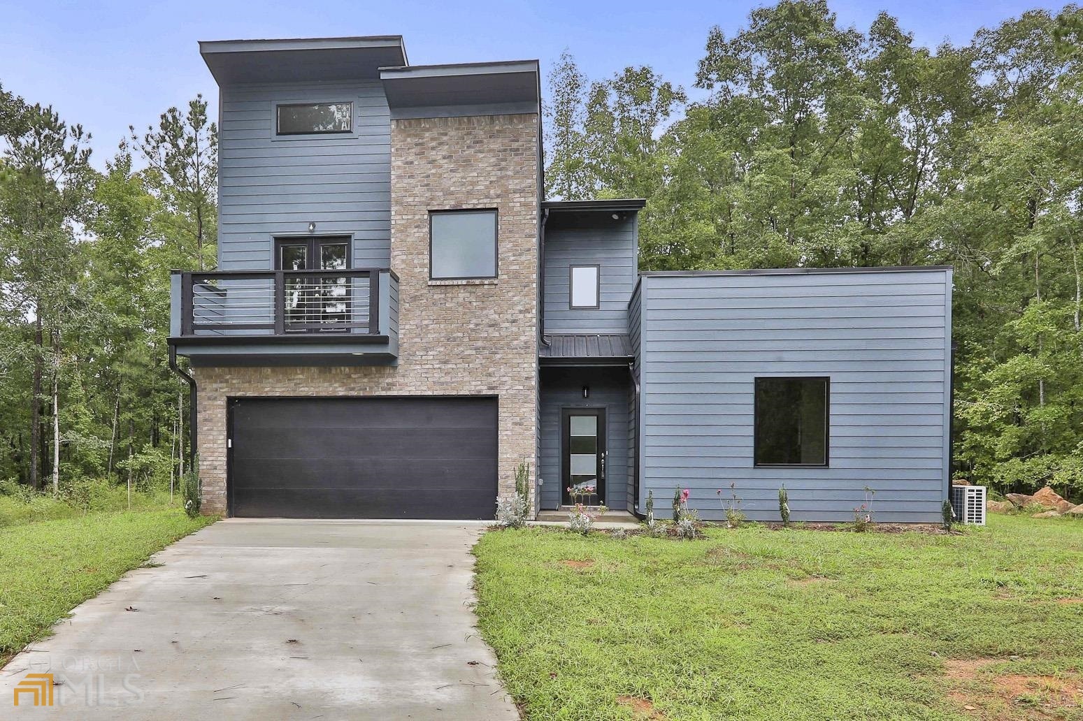 110 High Ridge Trail Jackson, GA 30233 - Photo 1 of 1 a front view of a house with a yard and garage