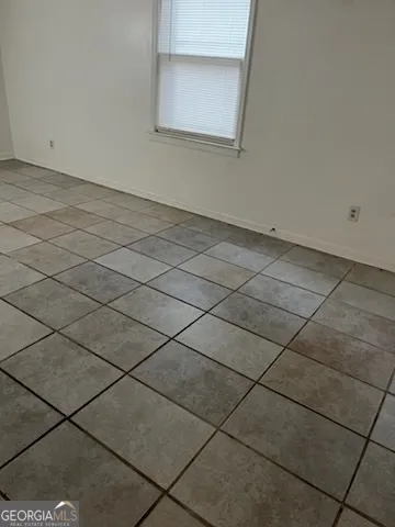 an empty room with a bench