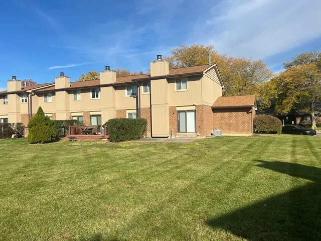 a view of a big yard with a house