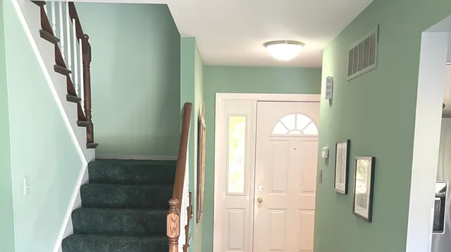 a view of staircase with wooden floor