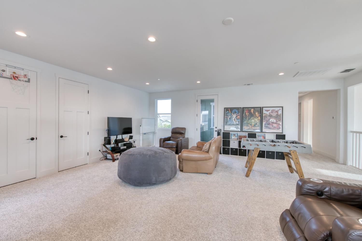 1736 North Renn Avenue Clovis, CA 93619 - Photo 26 of 66 a living room with furniture and a flat screen tv