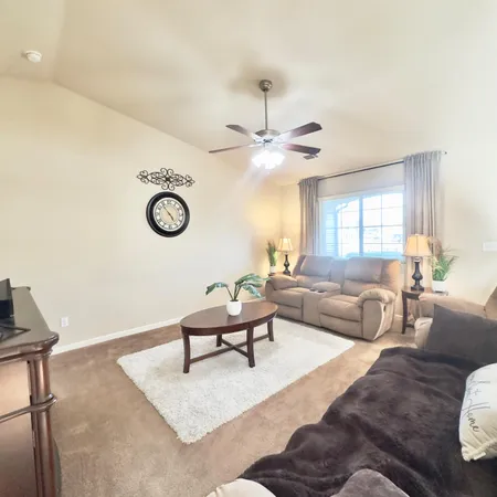 a kitchen with kitchen island a counter top space a sink cabinets and appliances