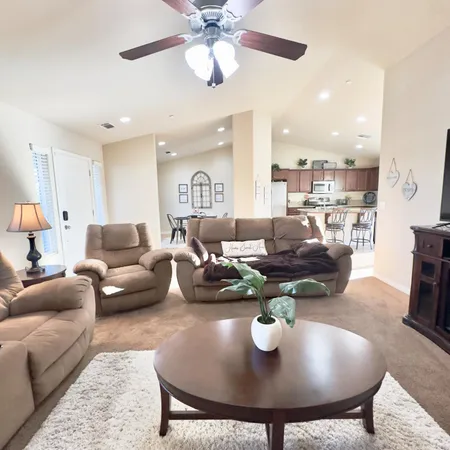 a view of a dining room with furniture and window