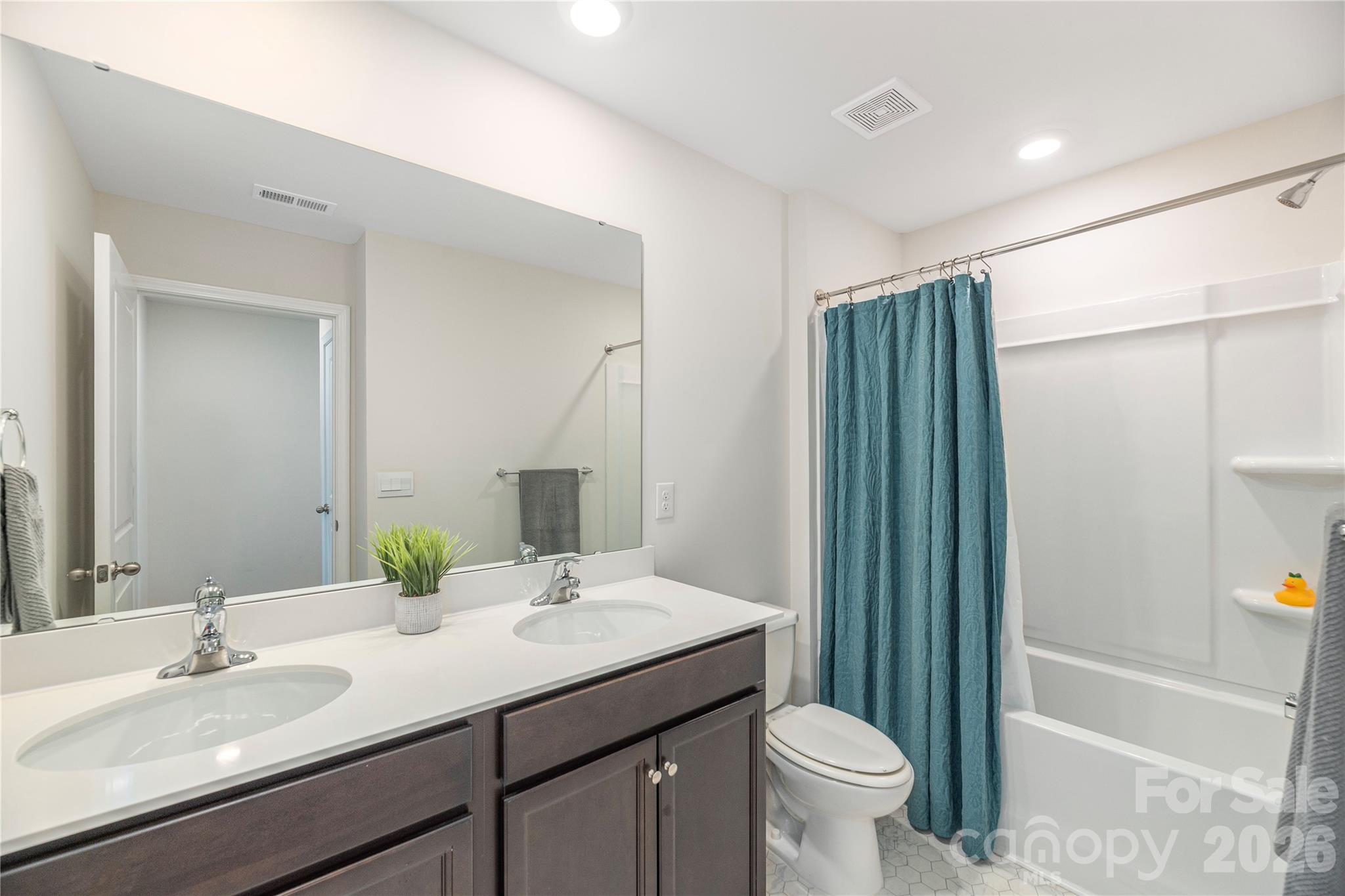 8 Madelyn Drive Clyde, NC 28721 - Photo 27 of 43 a bathroom with a granite countertop sink toilet and shower