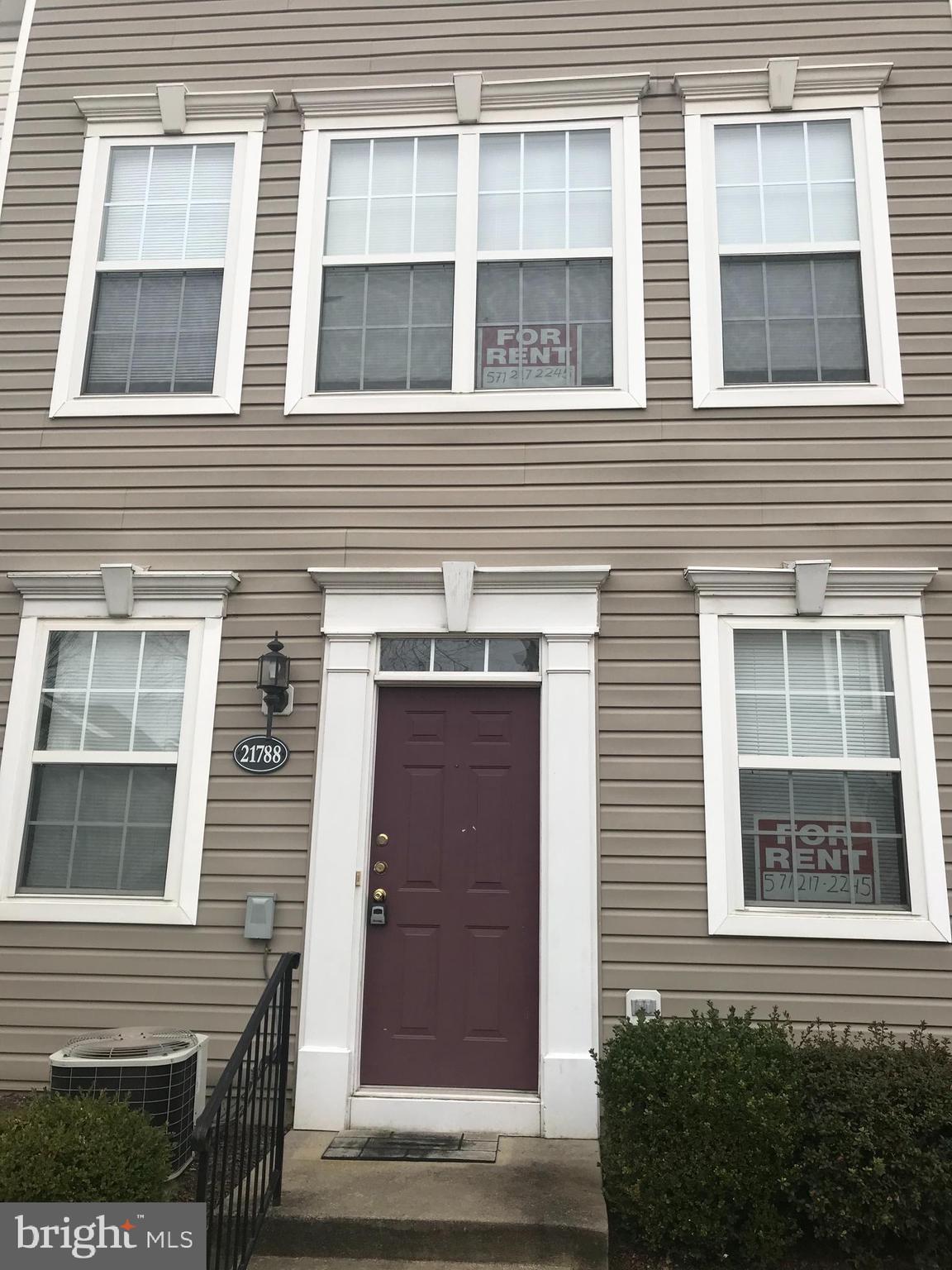 a view of a house with a door and a window