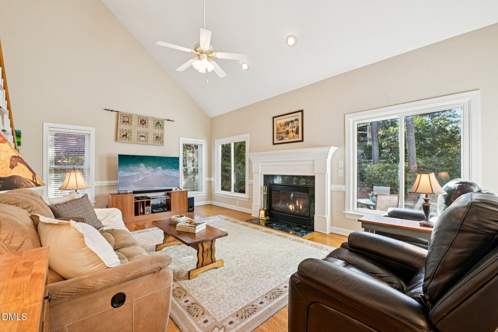 200 Ridge Creek Drive Morrisville, NC 27560 - Photo 14 of 38 a living room with furniture fireplace and a large window