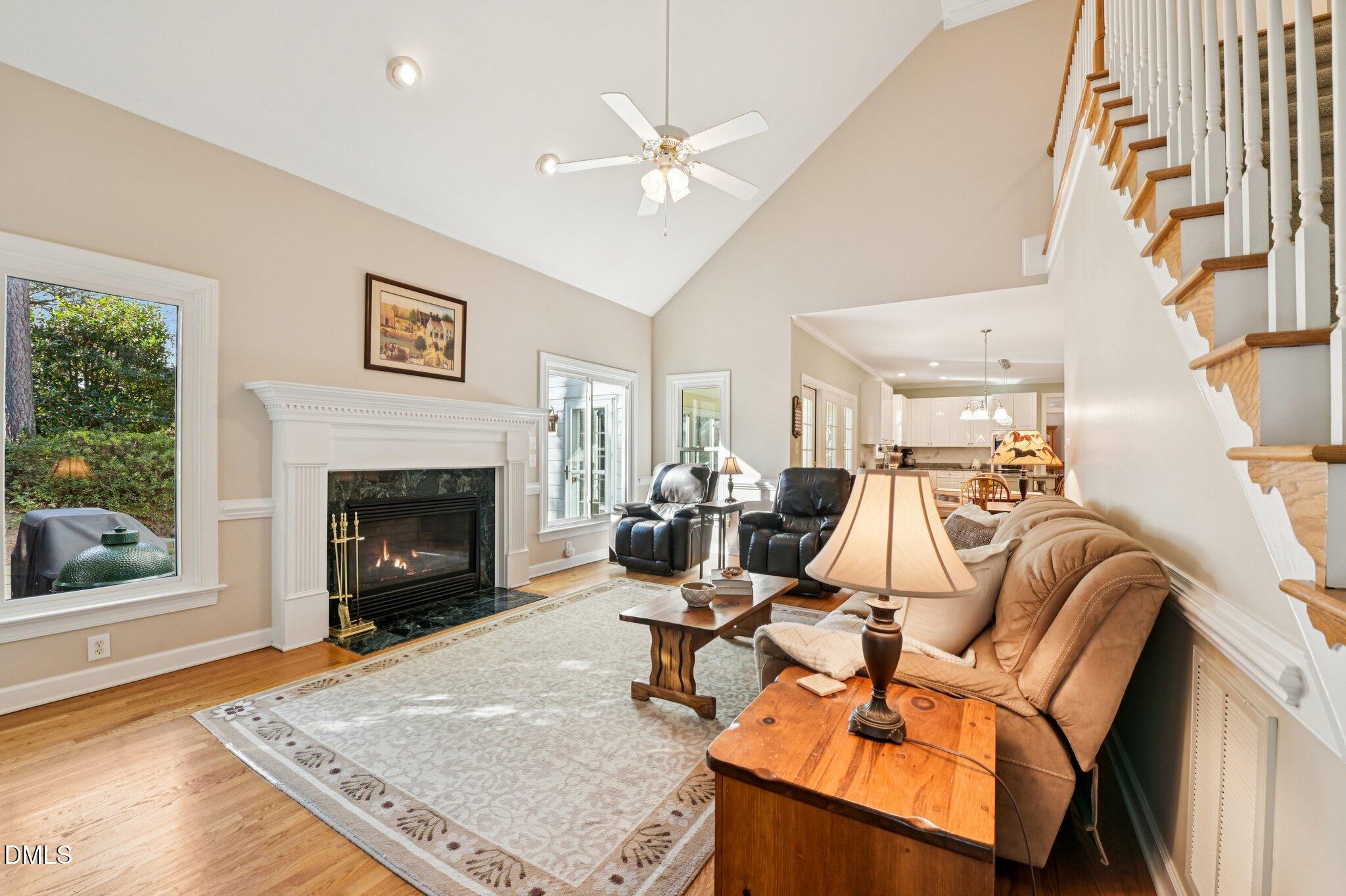 200 Ridge Creek Drive Morrisville, NC 27560 - Photo 16 of 38 a living room with furniture and a fireplace