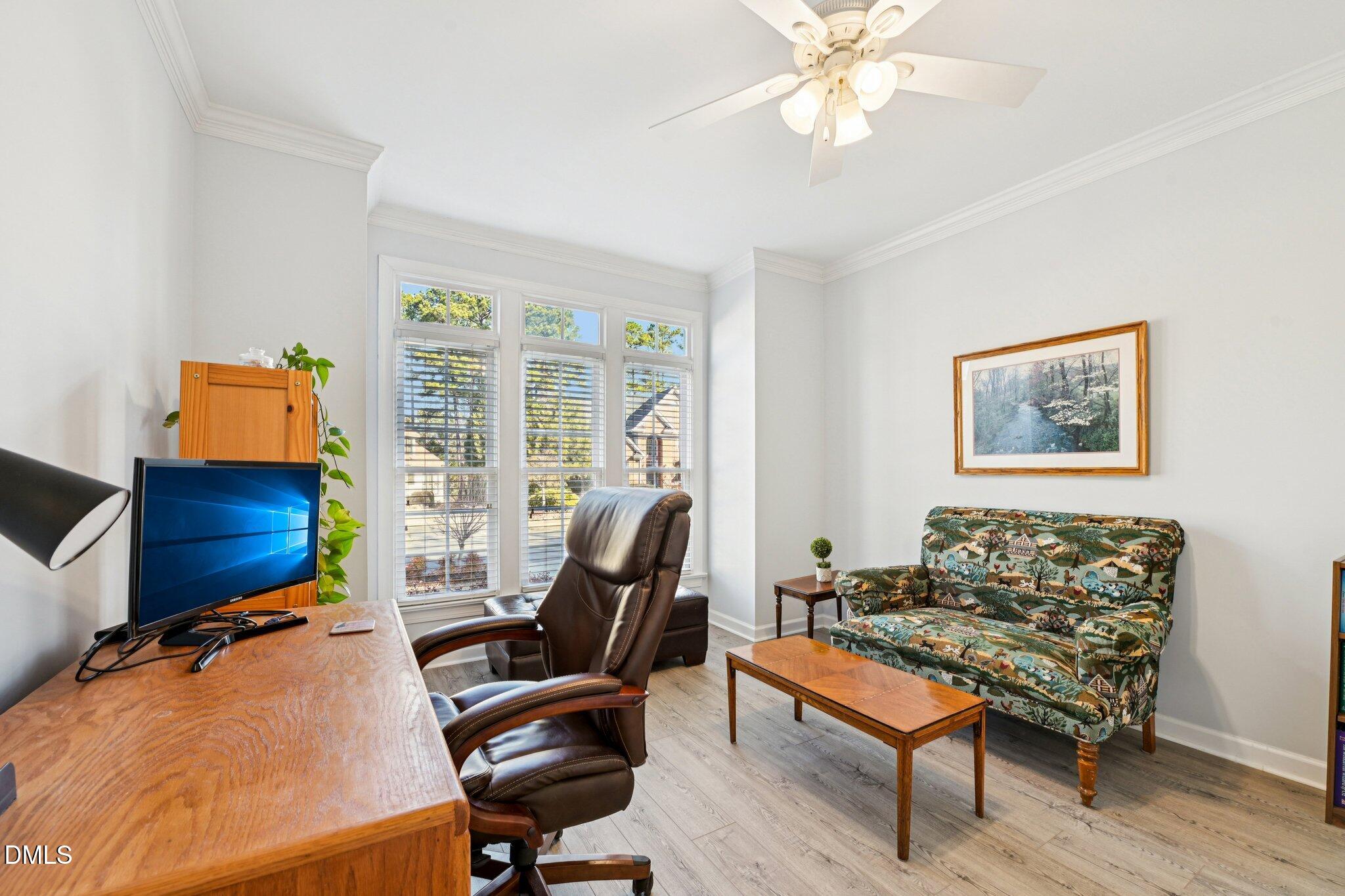 200 Ridge Creek Drive Morrisville, NC 27560 - Photo 17 of 38 a living room with furniture a desk and chair with windows