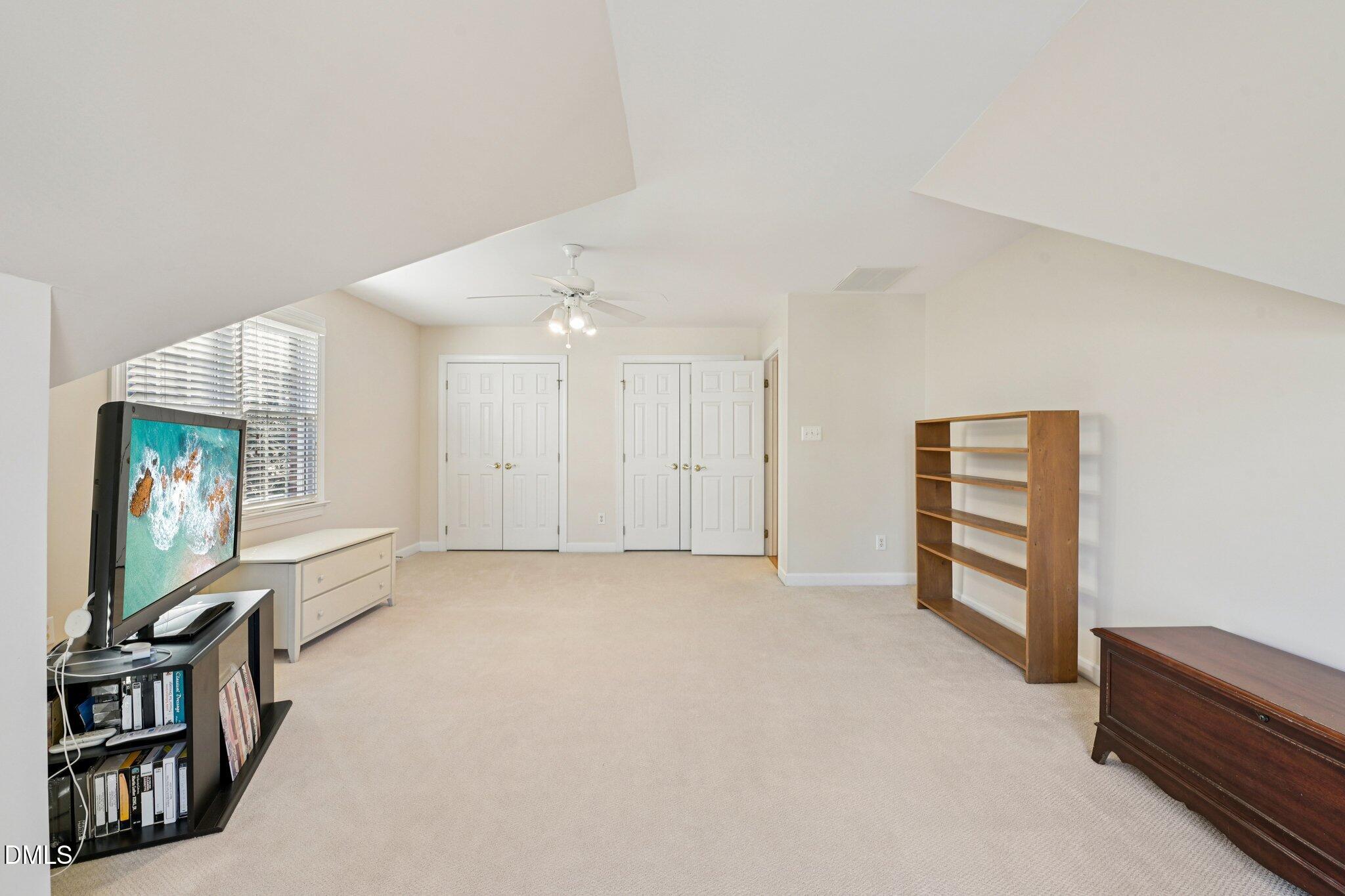 200 Ridge Creek Drive Morrisville, NC 27560 - Photo 29 of 38 an empty room with windows and wardrobe