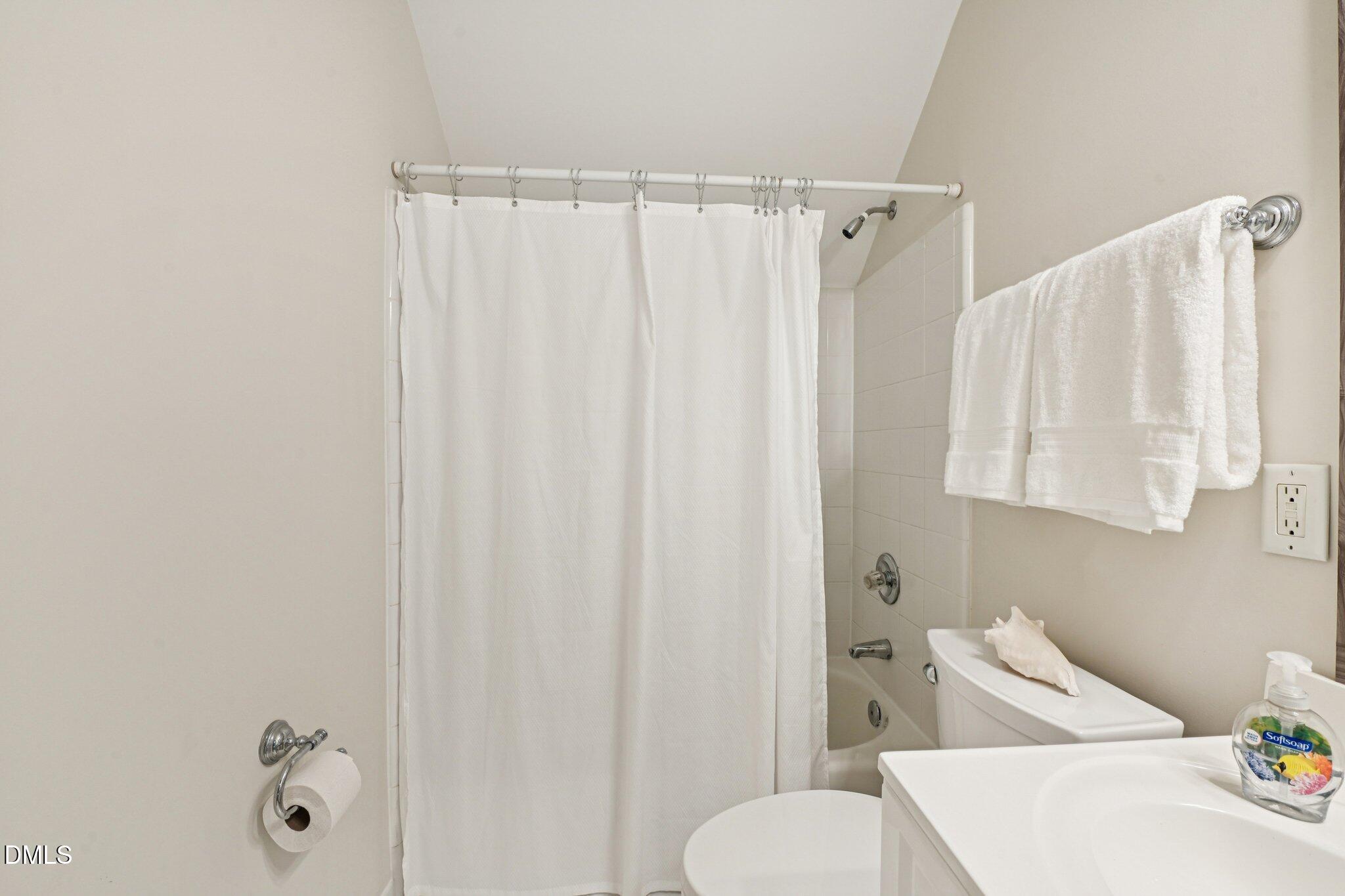 200 Ridge Creek Drive Morrisville, NC 27560 - Photo 30 of 38 a bathroom with a shower curtain and a sink