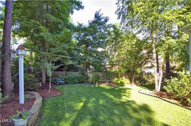 200 Ridge Creek Drive Morrisville, NC 27560 - Photo 38 of 38 a view of a garden with large trees