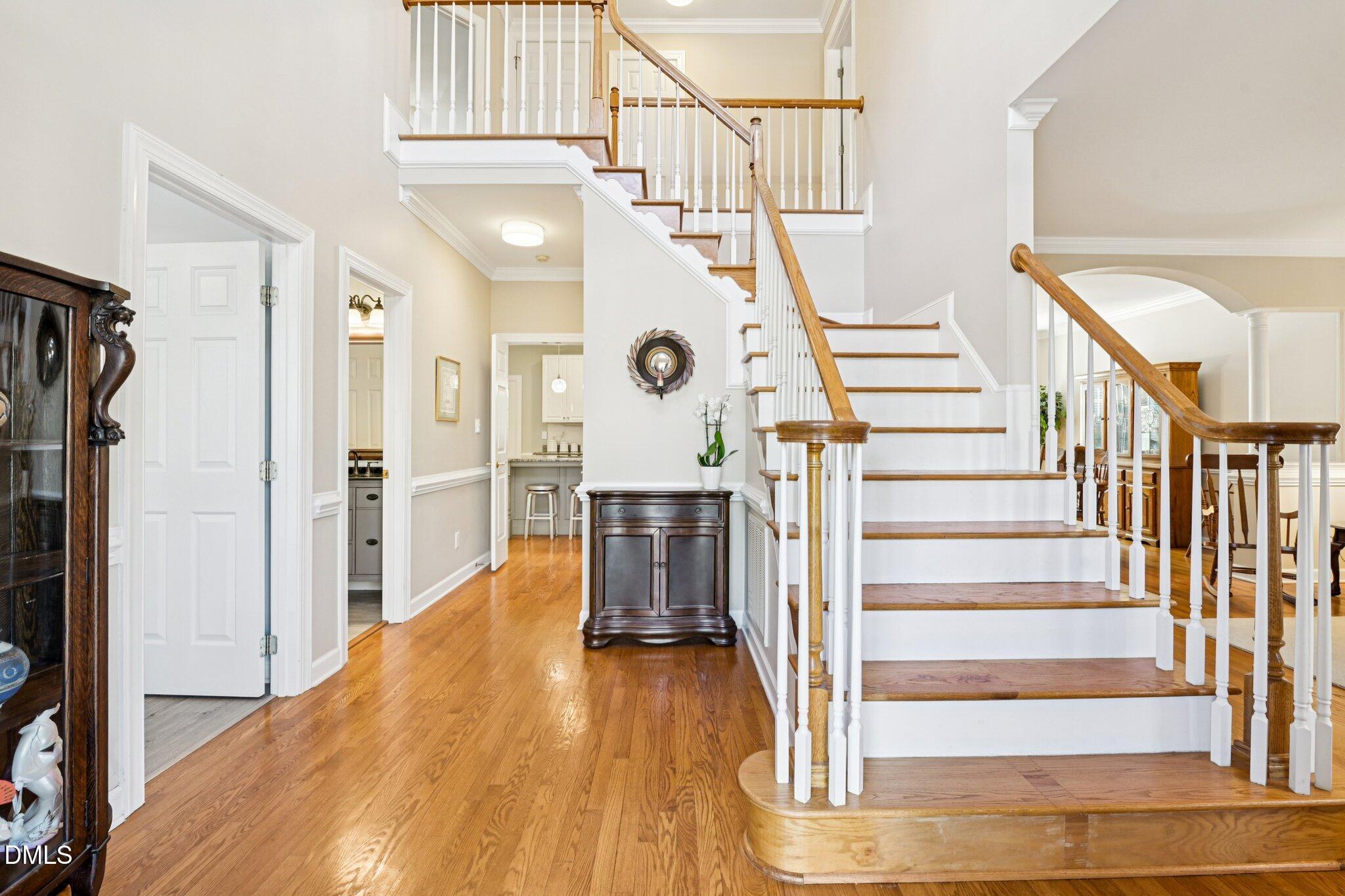 200 Ridge Creek Drive Morrisville, NC 27560 - Photo 4 of 38 a view of entryway and hall with wooden floor