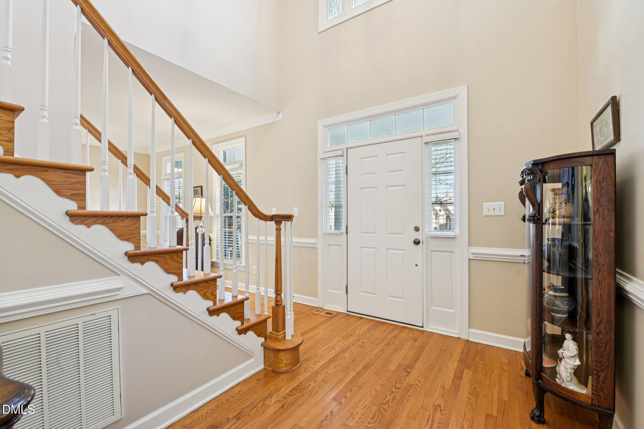 200 Ridge Creek Drive Morrisville, NC 27560 - Photo 5 of 38 a view of an entryway with wooden floor and stairs