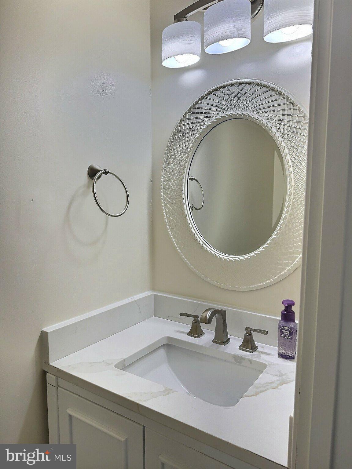 2001 Powder Horn Drive Fort Washington, MD 20744 - Photo 12 of 26 a bathroom with a granite countertop sink a mirror and vanity