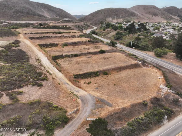 a view of a dry yard with mountain