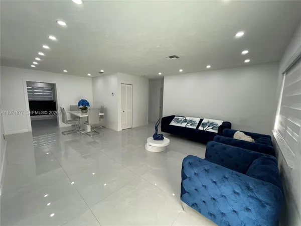 a living room with furniture and a couch