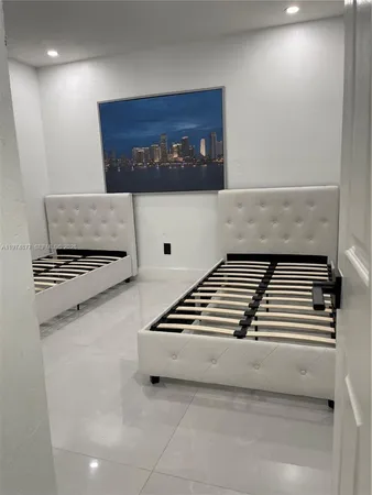 a front view of a house with a garden and yard