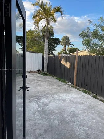 a backyard of a house with seating space