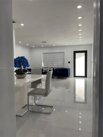 a room with lots of chairs and mirrors