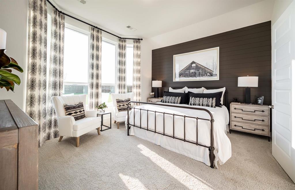 1222 Abbeygreen Road Forney, TX 75126 - Photo 18 of 29 a bedroom with furniture and a large window