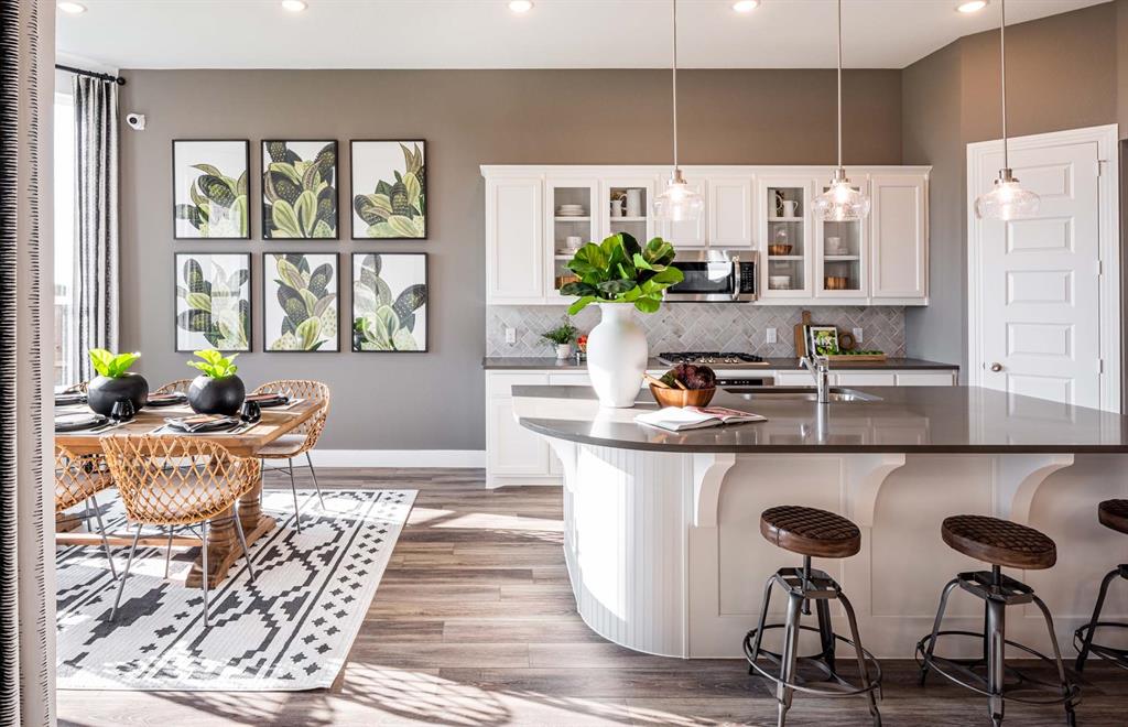 1222 Abbeygreen Road Forney, TX 75126 - Photo 5 of 29 a kitchen with a table chairs and entryway