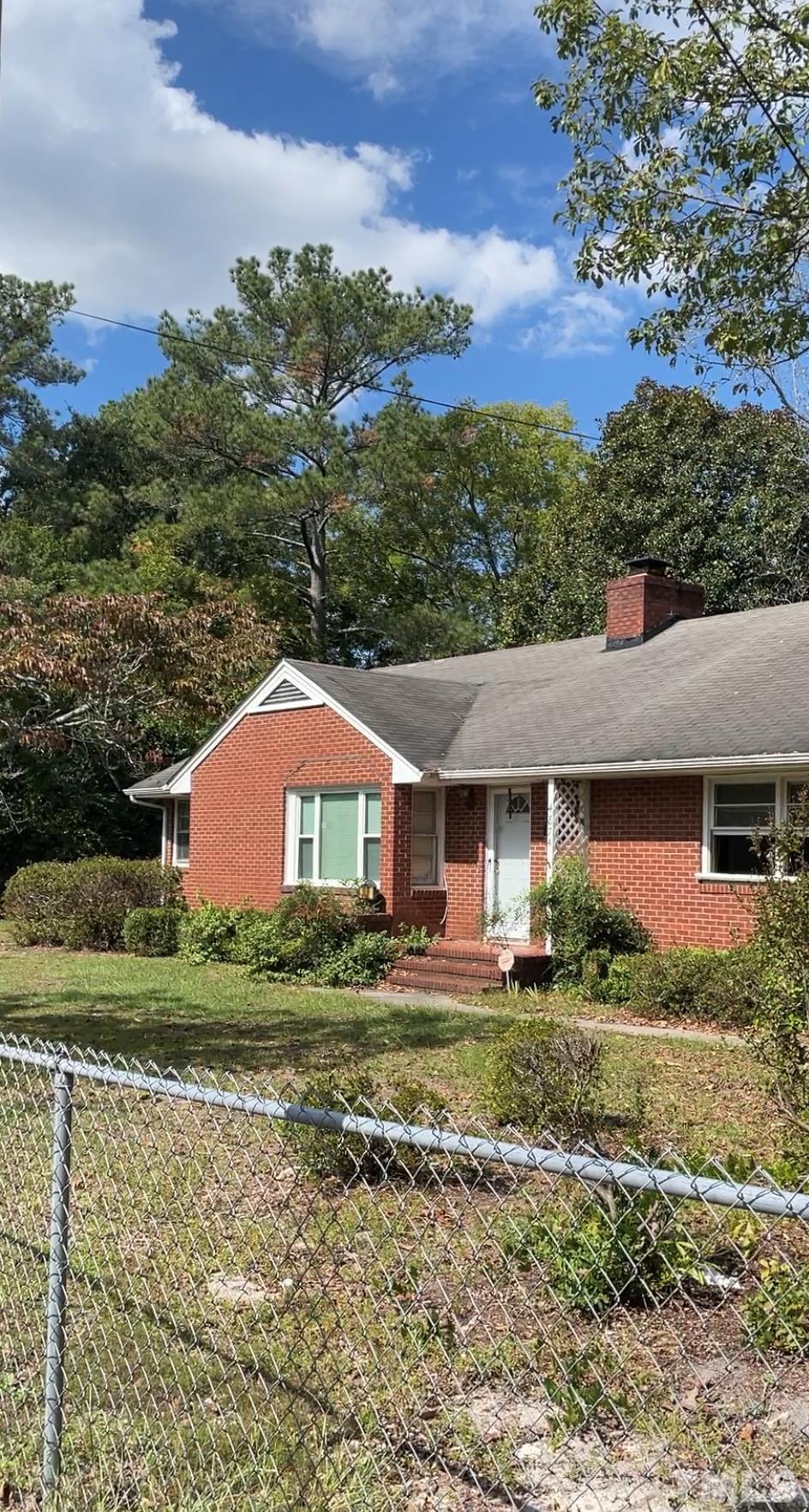 4874 Cameron Road Hope Mills, NC 28348 - Photo 2 of 21 a front view of a house with a yard