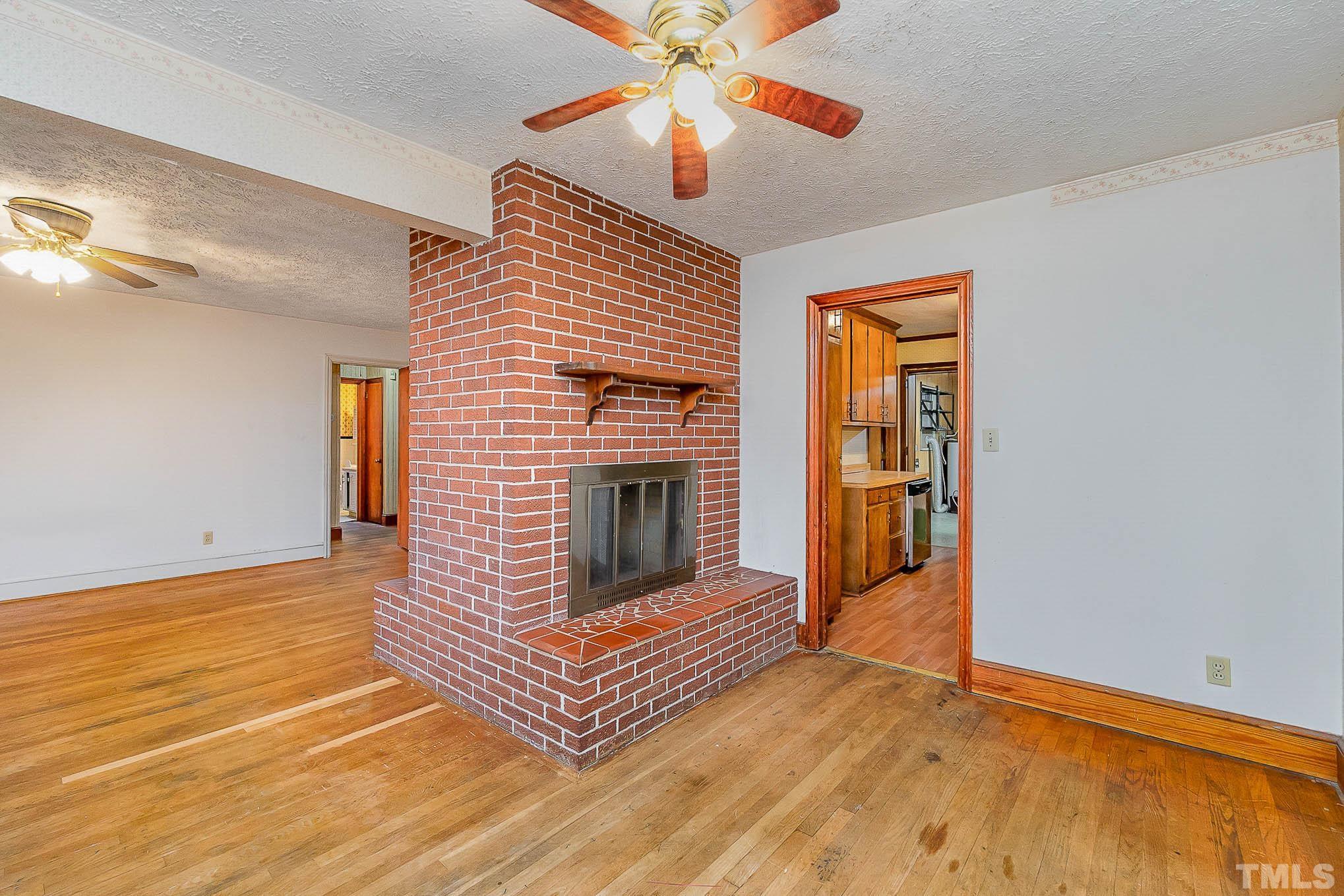 4874 Cameron Road Hope Mills, NC 28348 - Photo 11 of 21 a view of fireplace and wooden floor