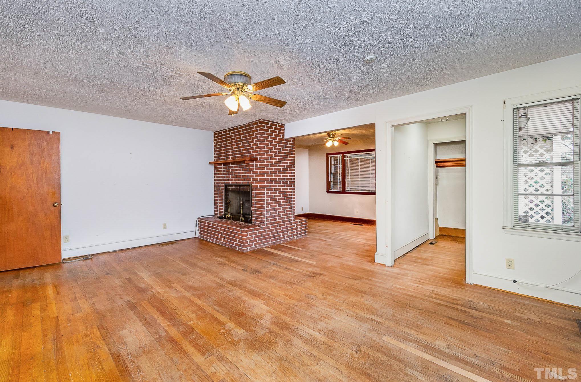 4874 Cameron Road Hope Mills, NC 28348 - Photo 12 of 21 a view of an empty room with a window and a fireplace