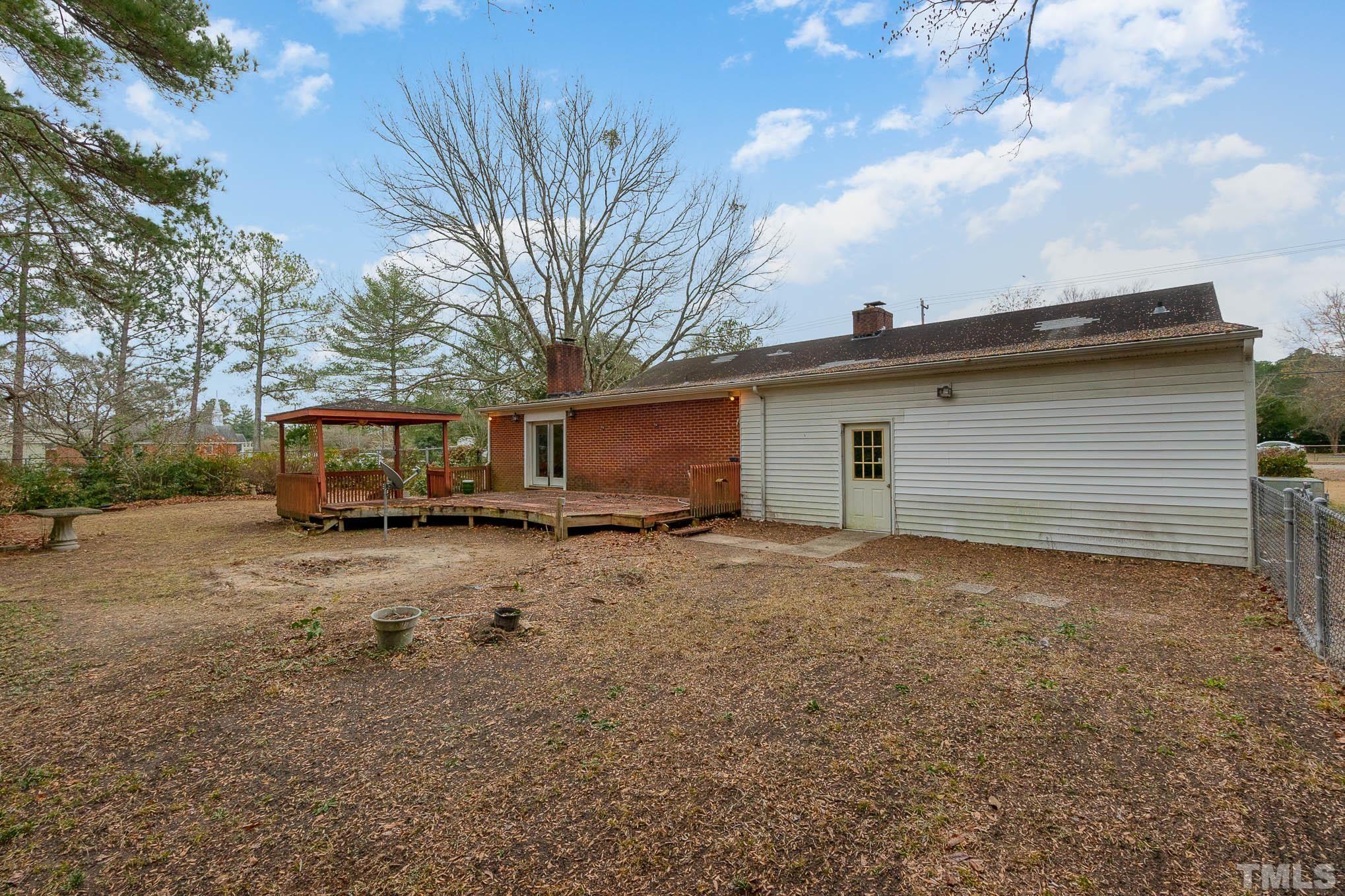4874 Cameron Road Hope Mills, NC 28348 - Photo 20 of 21 a view of a house with a yard