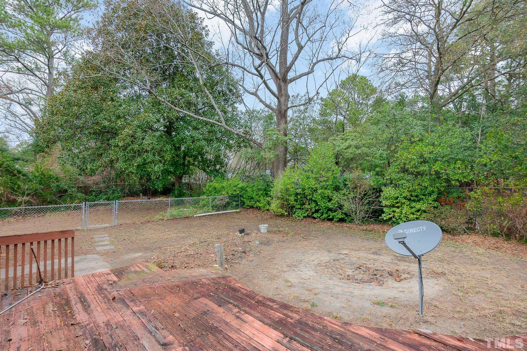 4874 Cameron Road Hope Mills, NC 28348 - Photo 21 of 21 a view of backyard with outdoor seating and green space