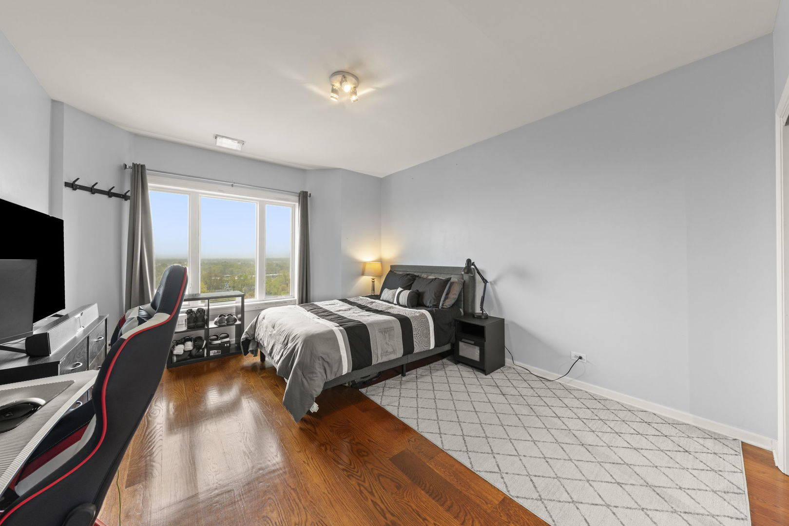 1 Renaissance Place, Unit PH2 Palatine, IL 60067 - Photo 12 of 23 a bedroom with a bed and a flat tv screen on the dresser