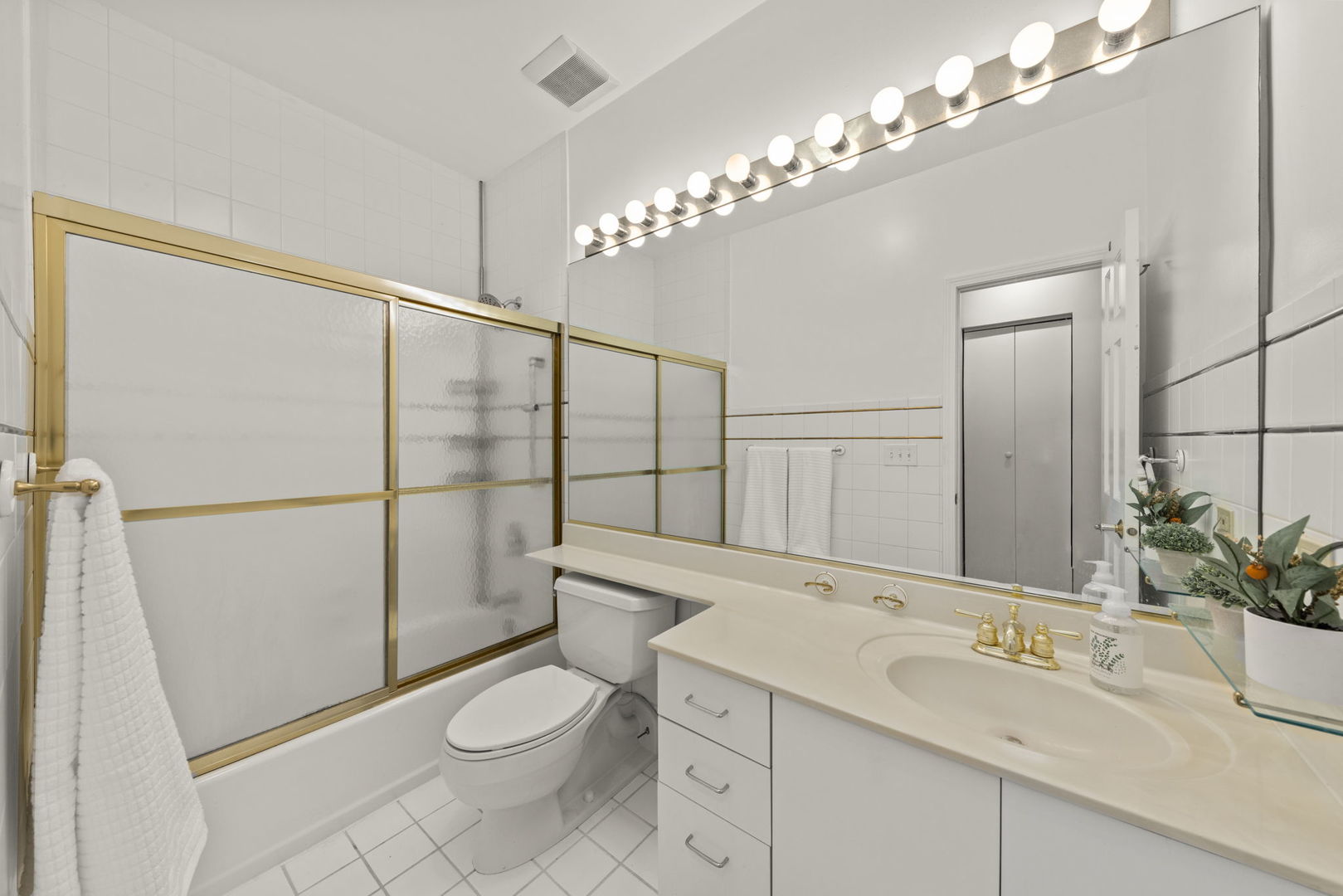 1 Renaissance Place, Unit PH2 Palatine, IL 60067 - Photo 14 of 23 a bathroom with a sink a toilet a mirror and shower