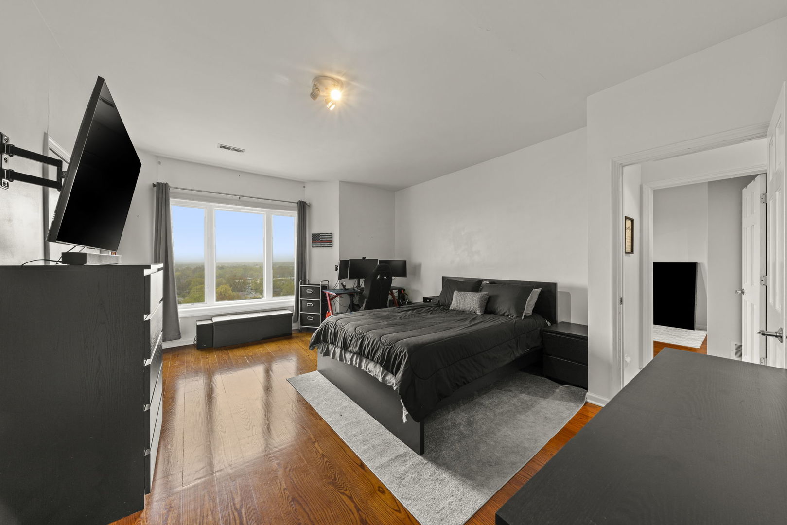 1 Renaissance Place, Unit PH2 Palatine, IL 60067 - Photo 15 of 23 a bed room with a bed furniture and a flat screen tv