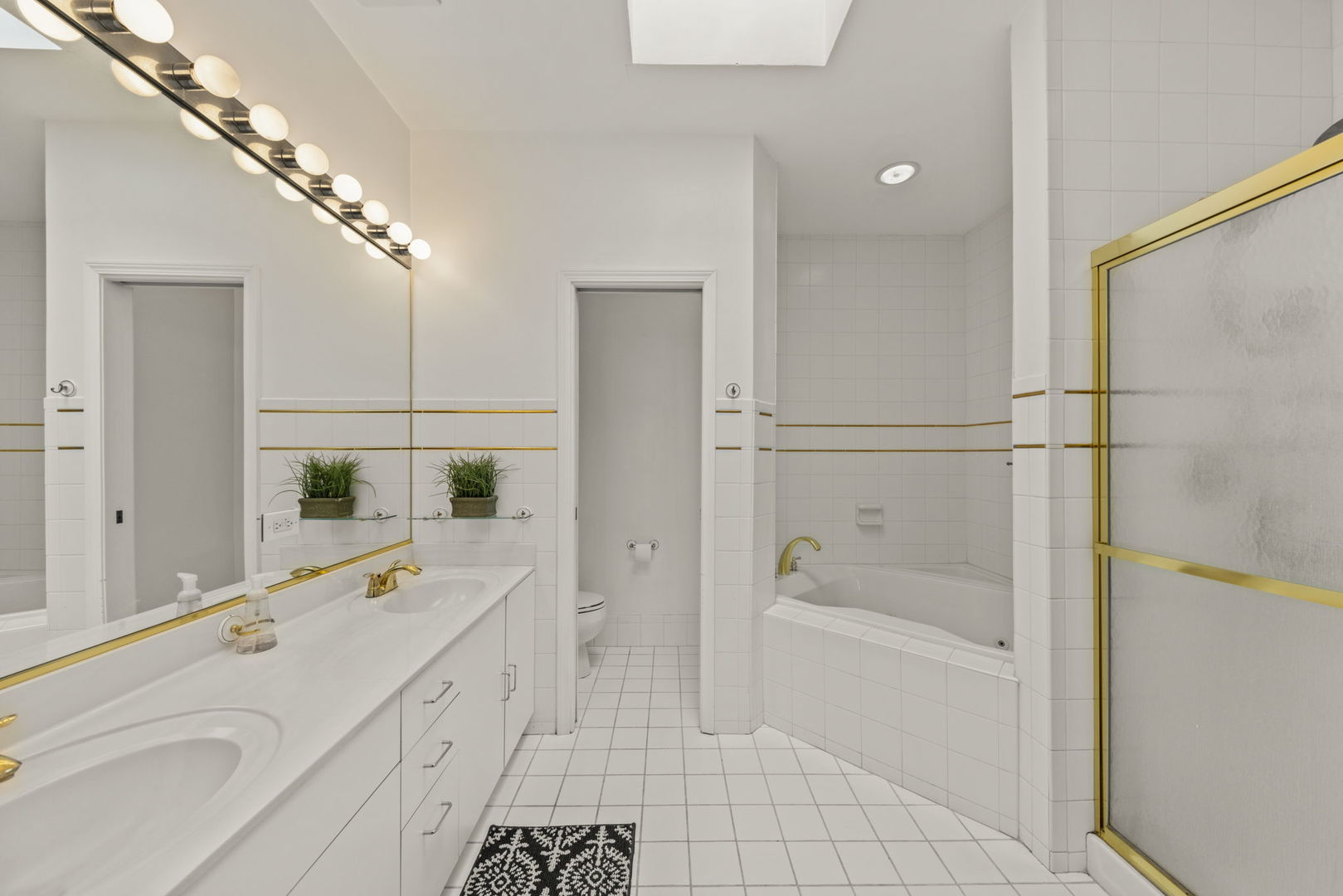 1 Renaissance Place, Unit PH2 Palatine, IL 60067 - Photo 17 of 23 a bathroom with a tub sink a mirror and a shower